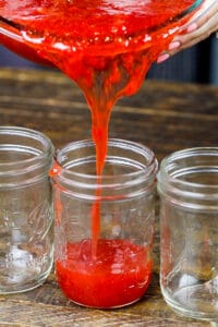 image of certo freezer jam being poured into a wide mouthed mason jar