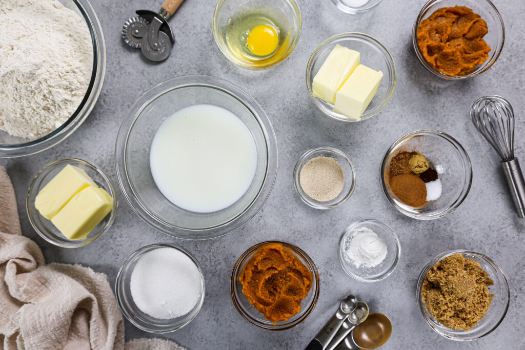 image of ingredients laid out to make pumpkin pie cinnamon rolls