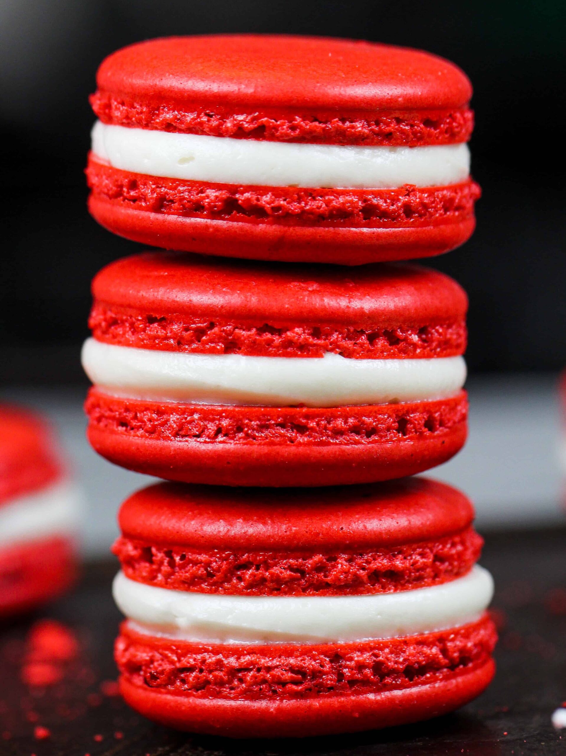 image of red velvet macarons filled with cream cheese frosting