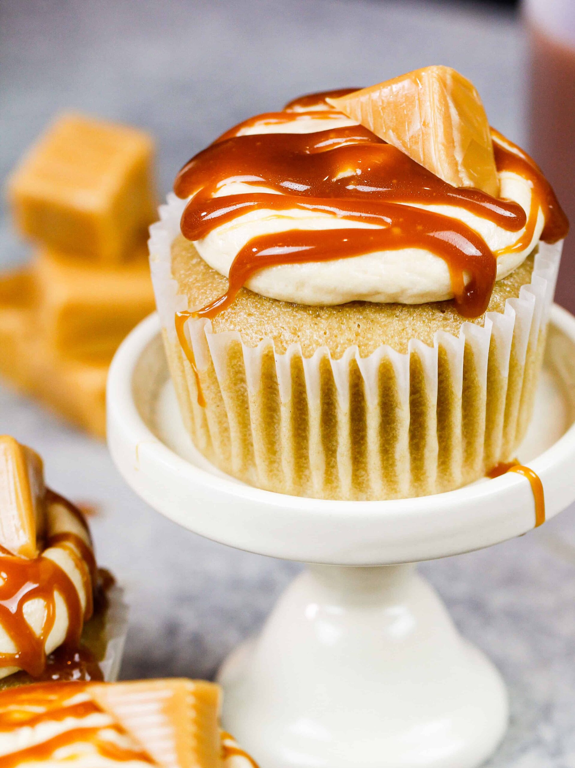 image of caramel cupcakes filled with chewy caramel and topped with a caramel drizzle