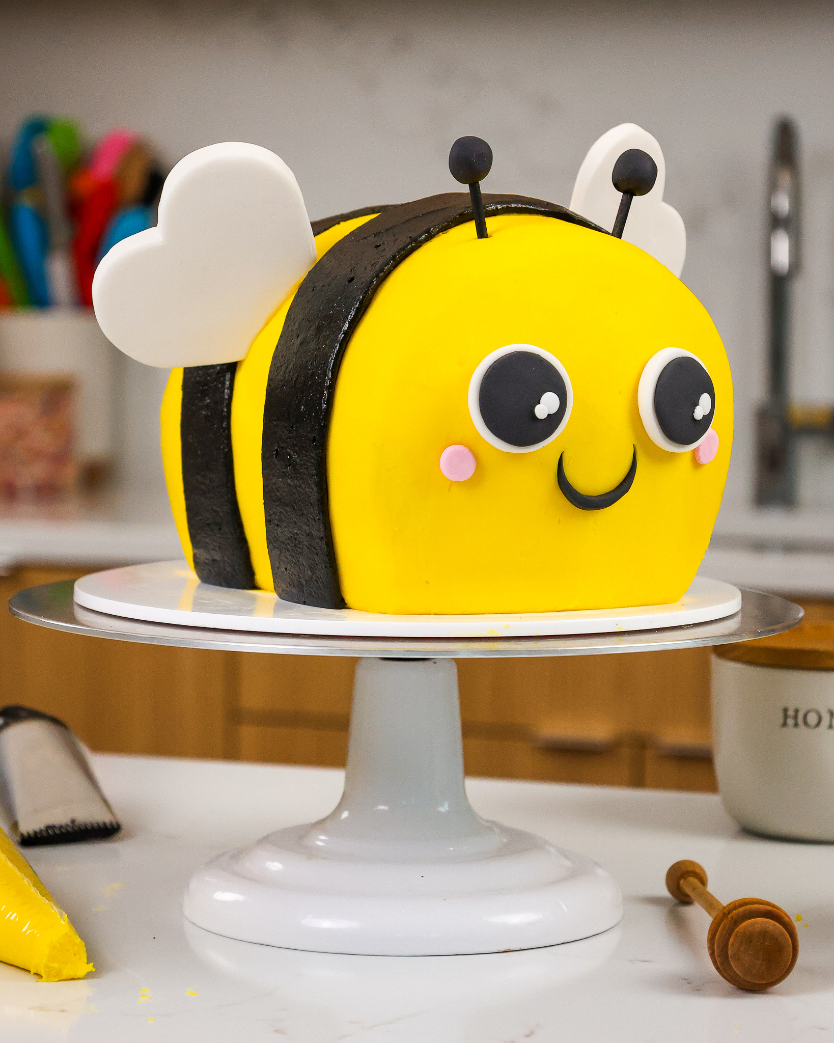 image of an adorable bumblebee cake made with black cocoa and honey buttercream