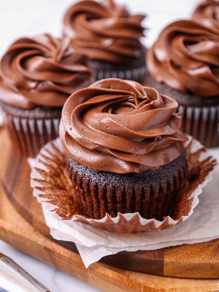 image of moist chocolate cupcakes that have been frosted with a decadent dark chocolate buttercream