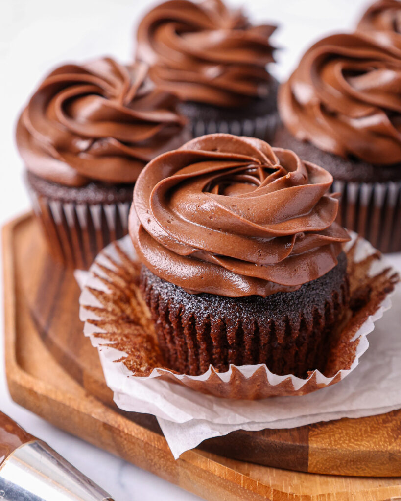 image of moist chocolate cupcakes that have been frosted with a decadent dark chocolate buttercream