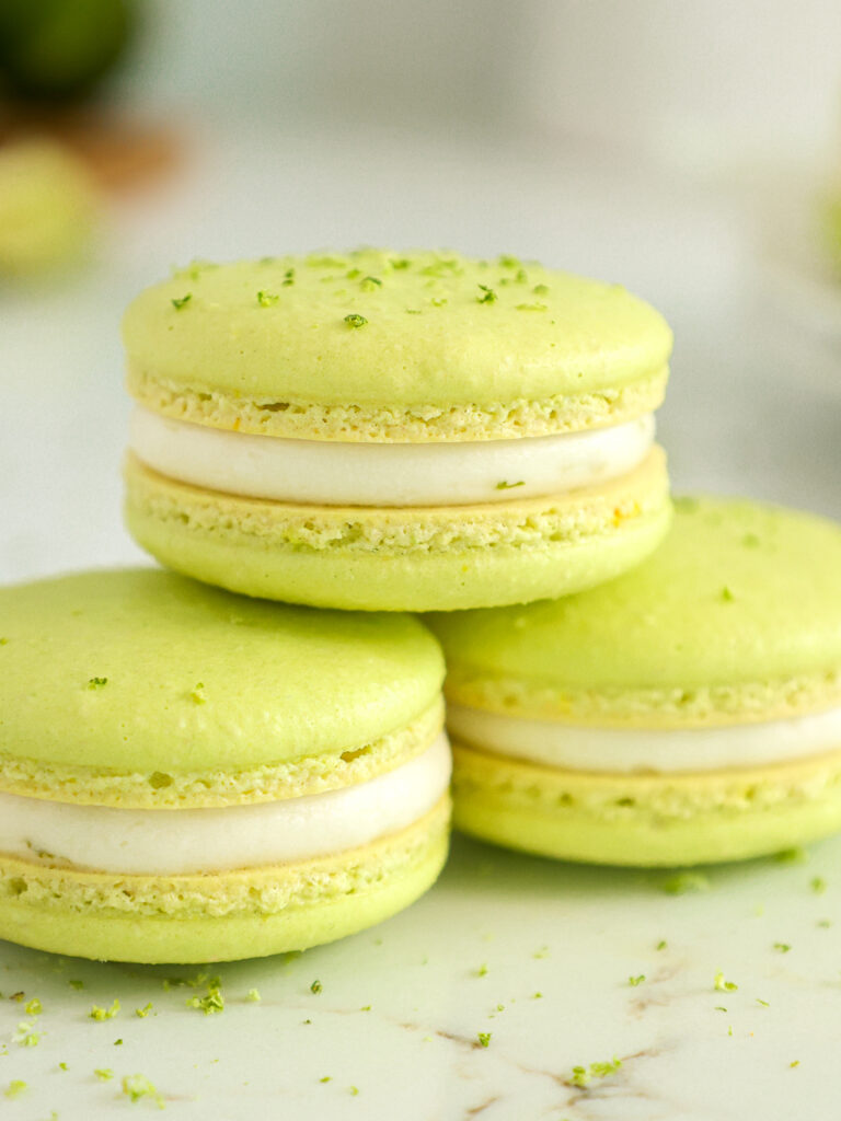 image of lime macarons stacked on top of each other