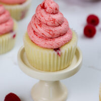 image of raspberry cupcakes made with vanilla cupcakes and raspberry buttercream