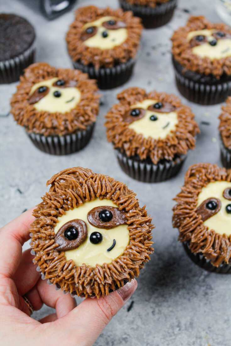 image of adorable sloth cupcakes made with chocolate cupcakes and chocolate peanut butter frosting