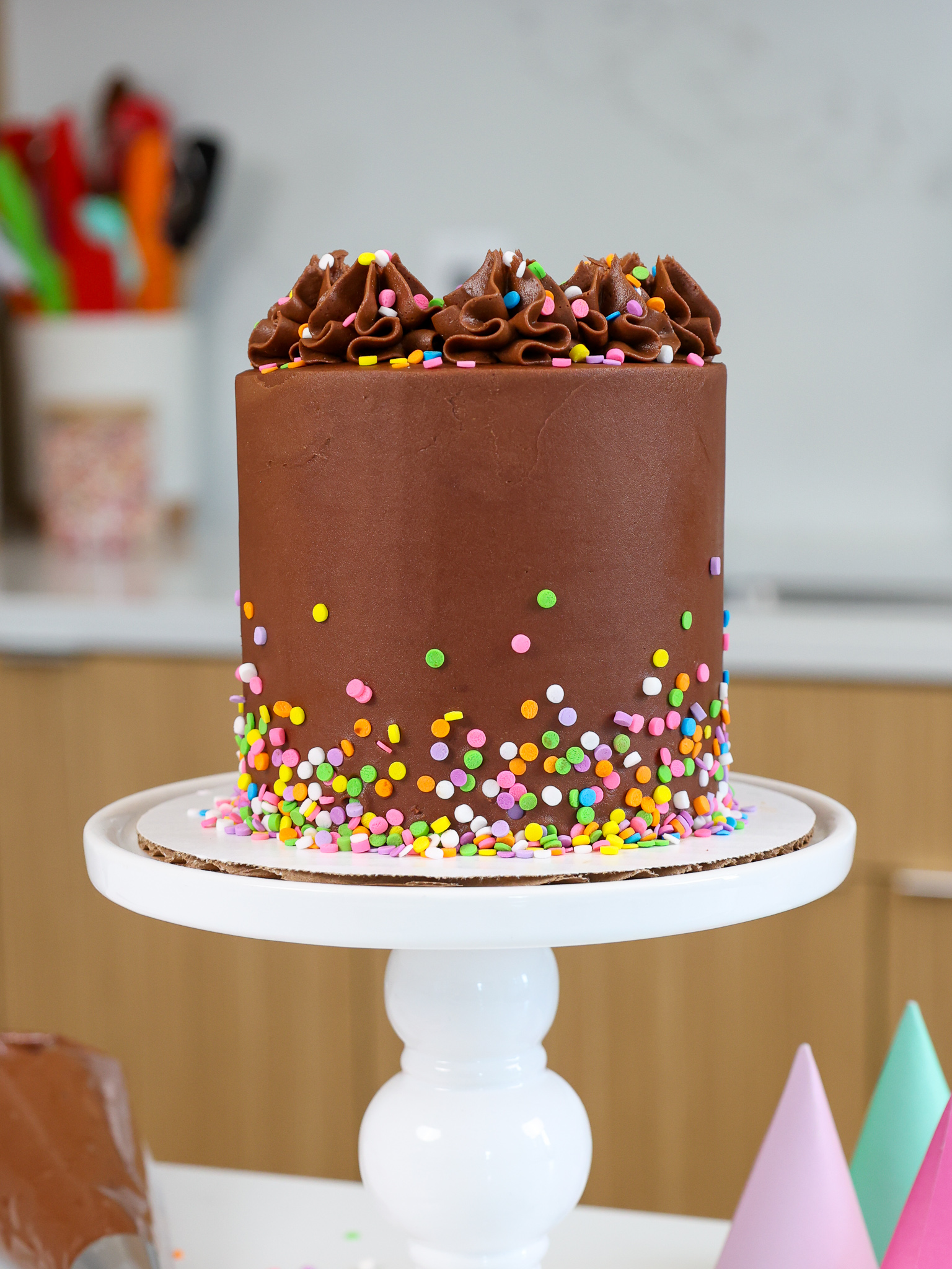 image of a small, 4-inch chocolate cake that's been frosted with chocolate buttercream