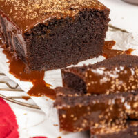 image of a chocolate sour cream bundt cake that's been sliced to show how tender and moist it is