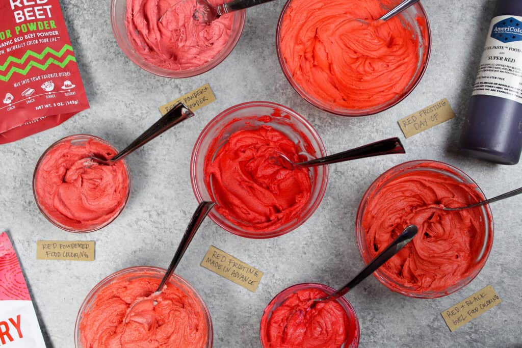 image of red buttercream made with different types of food coloring, red powdered food coloring, and natural food coloring like beet powder