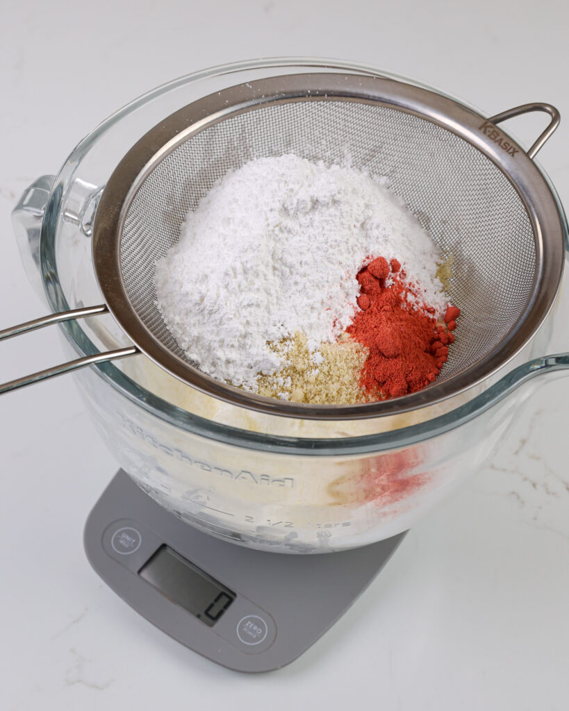 image of dry ingredients being weighted on a scale to make strawberry macarons