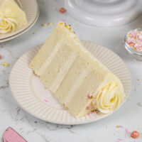 image of a vanilla cake that's filled with a white chocolate mousse cake filling