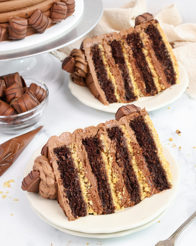 image of two slices of chocolate kinder bueno cake that have been put on plates