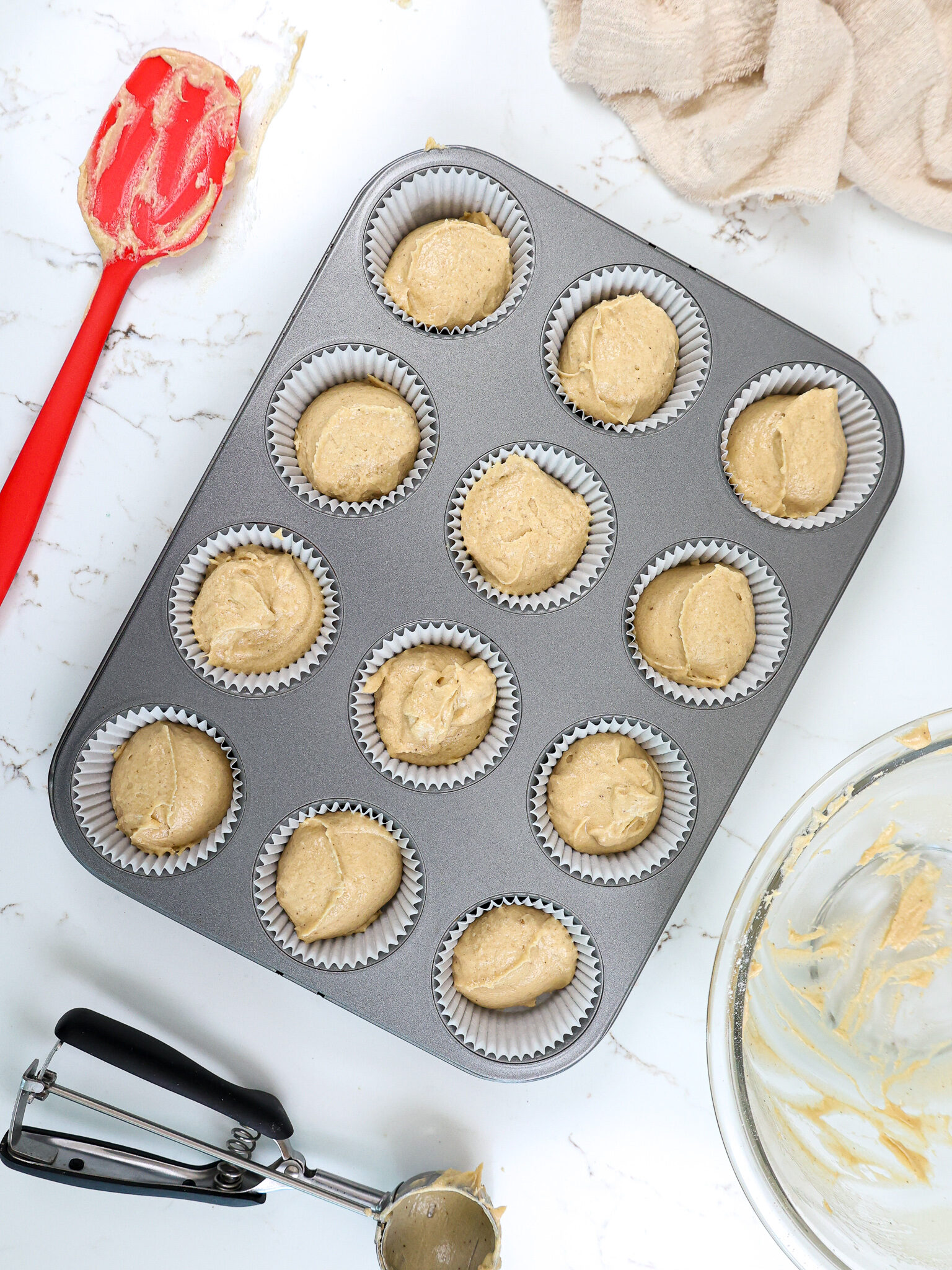 image of spice cupcake batter that's been scooped into a muffin pan and is ready to go in the oven