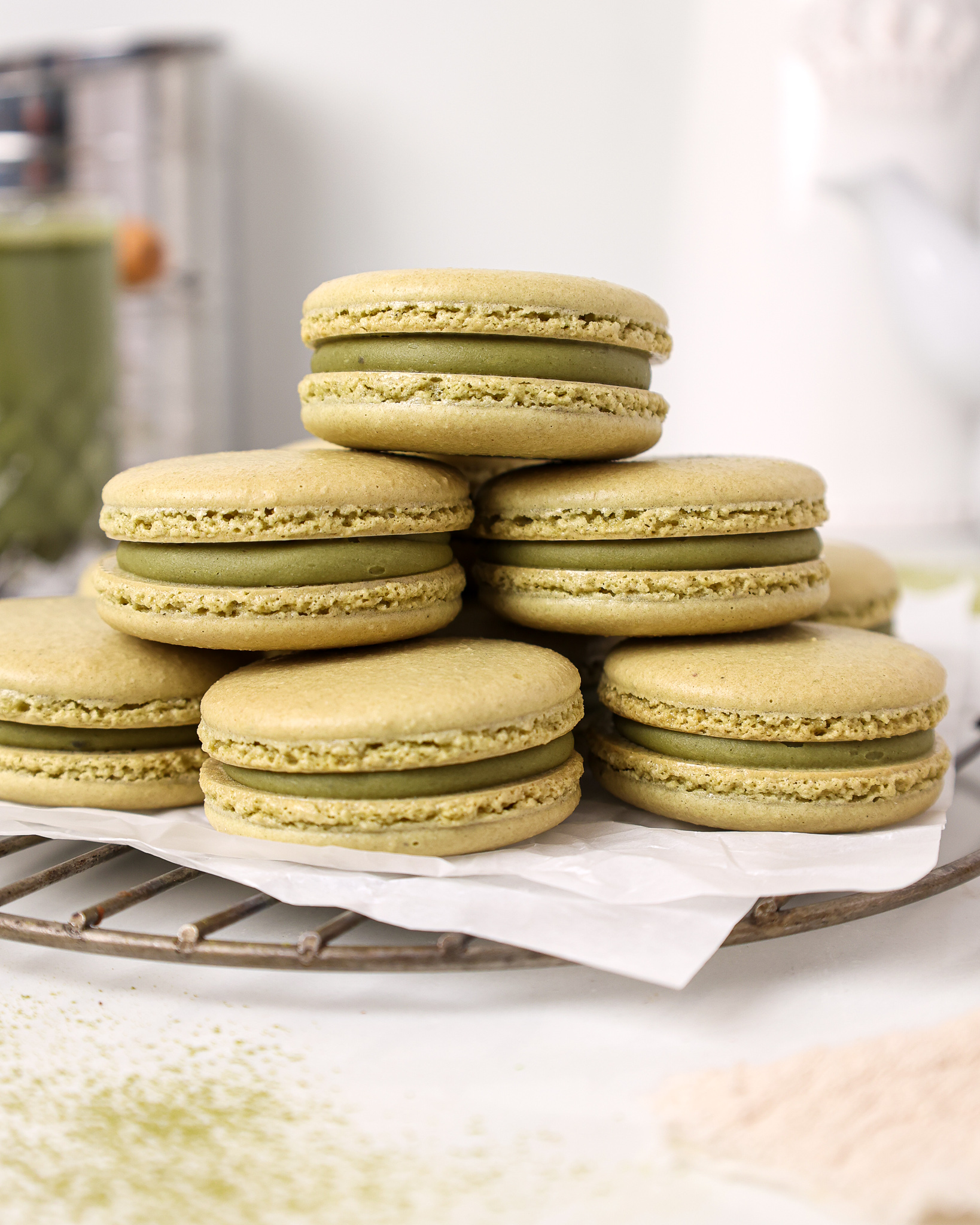 image of matcha macarons stacked and filled with matcha white chocolate ganache