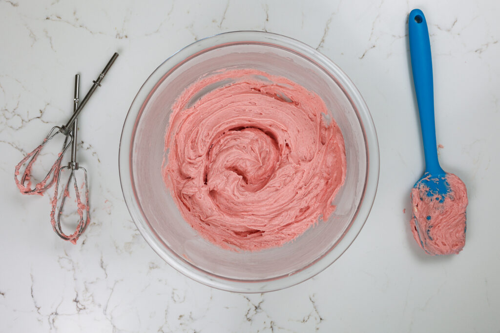 image of strawberry buttercream frosting made with strawberry jam