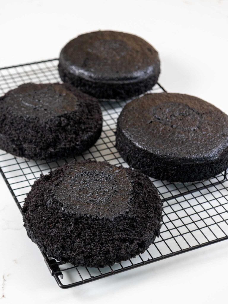 image of dark chocolate cake layers that have been trimmed with a serrated knife