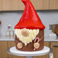 image of an adorable gnome cake that's been made with buttercream and rice krispie treats