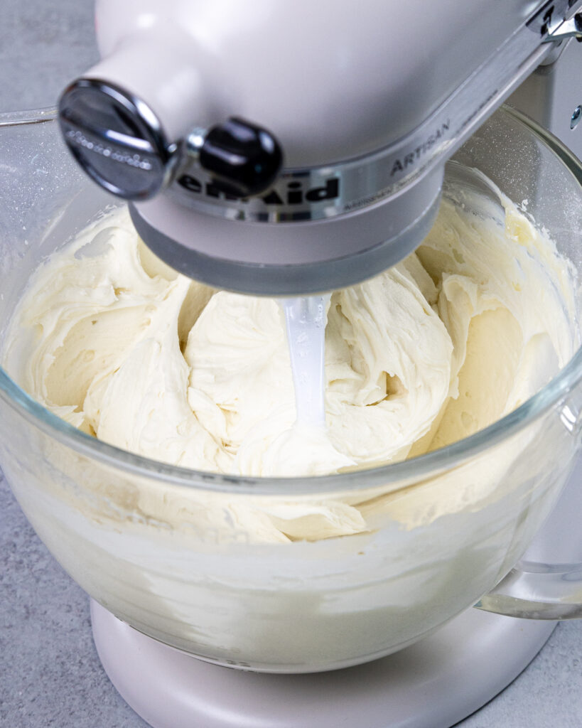 image of vanilla buttercream being mixed in a kitchen aid mixer