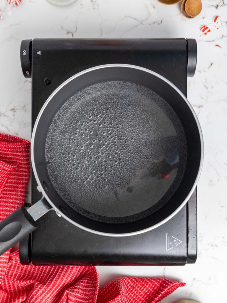 image of water being boiled in a saucepan