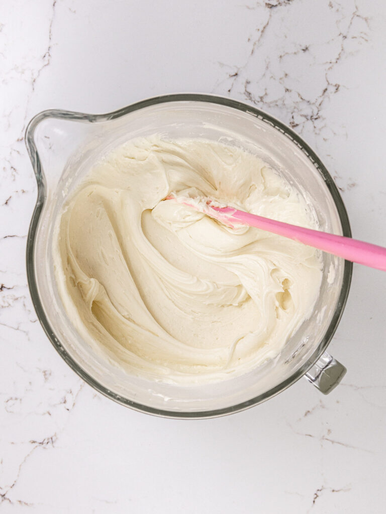 image of vanilla buttercream being mixed that's smooth